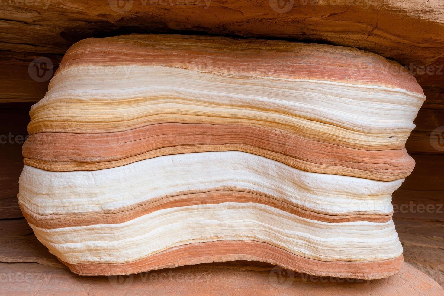 Striped sandstone rock formation in desert canyon photo