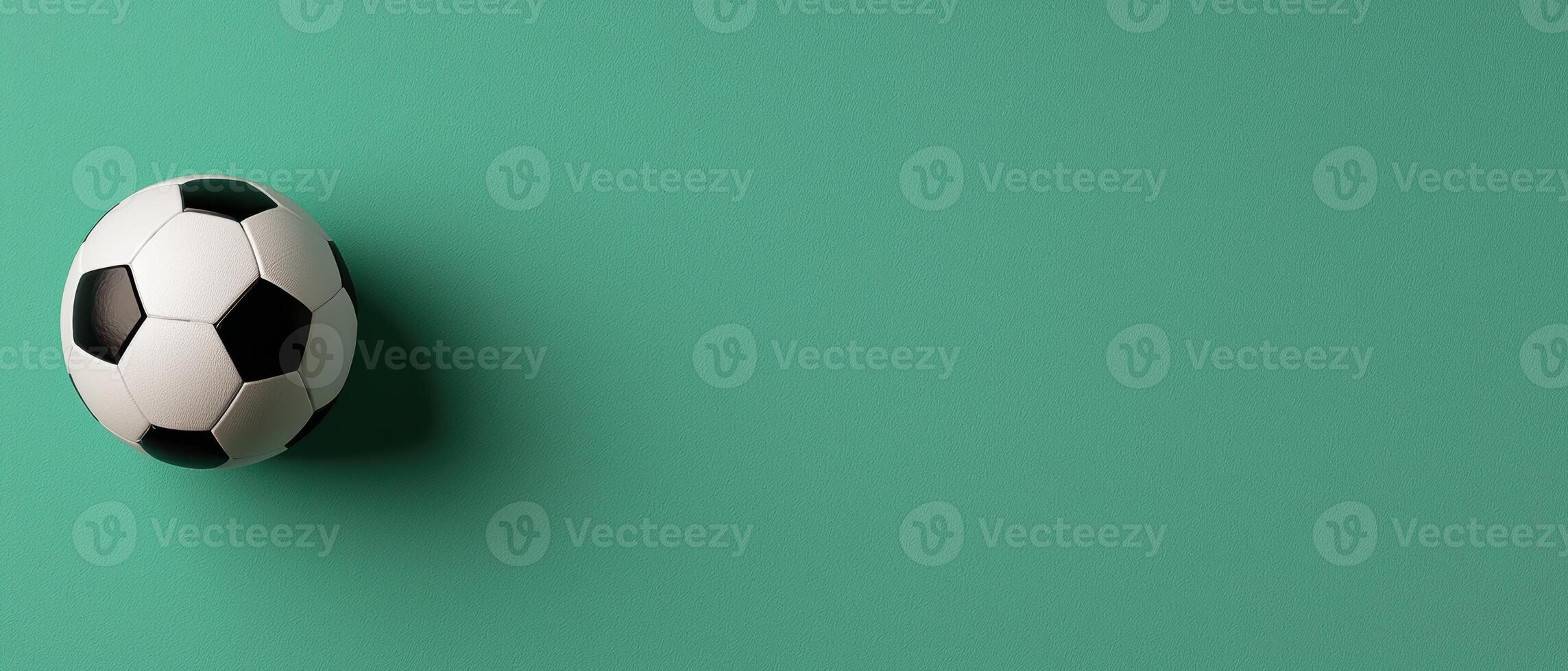 Single soccer ball on green background photo