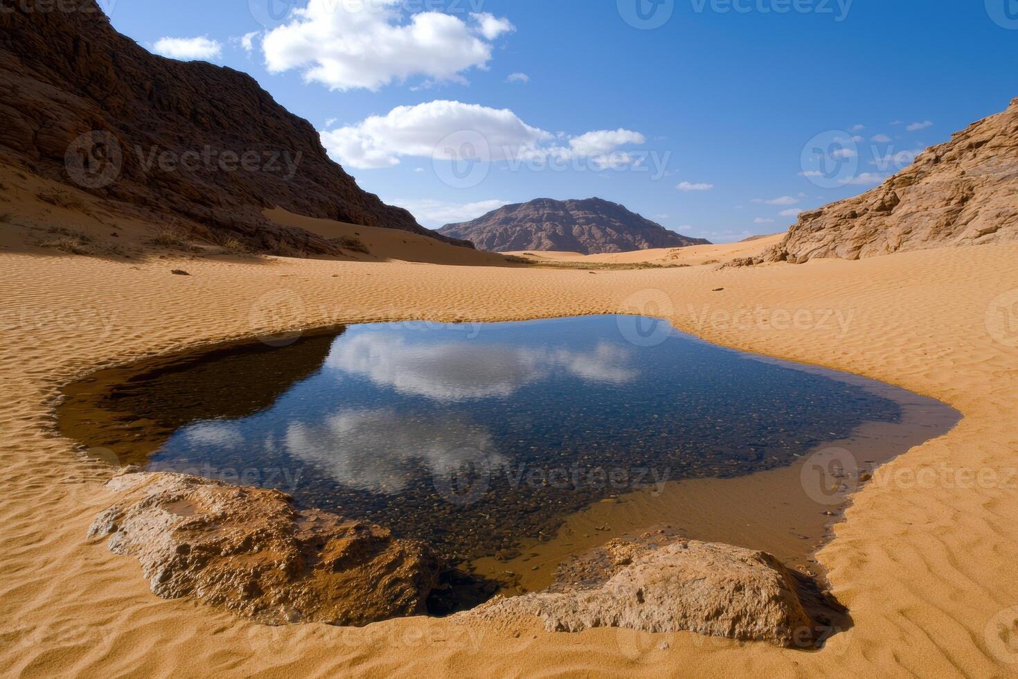 Oasis in the desert reflecting the sky photo