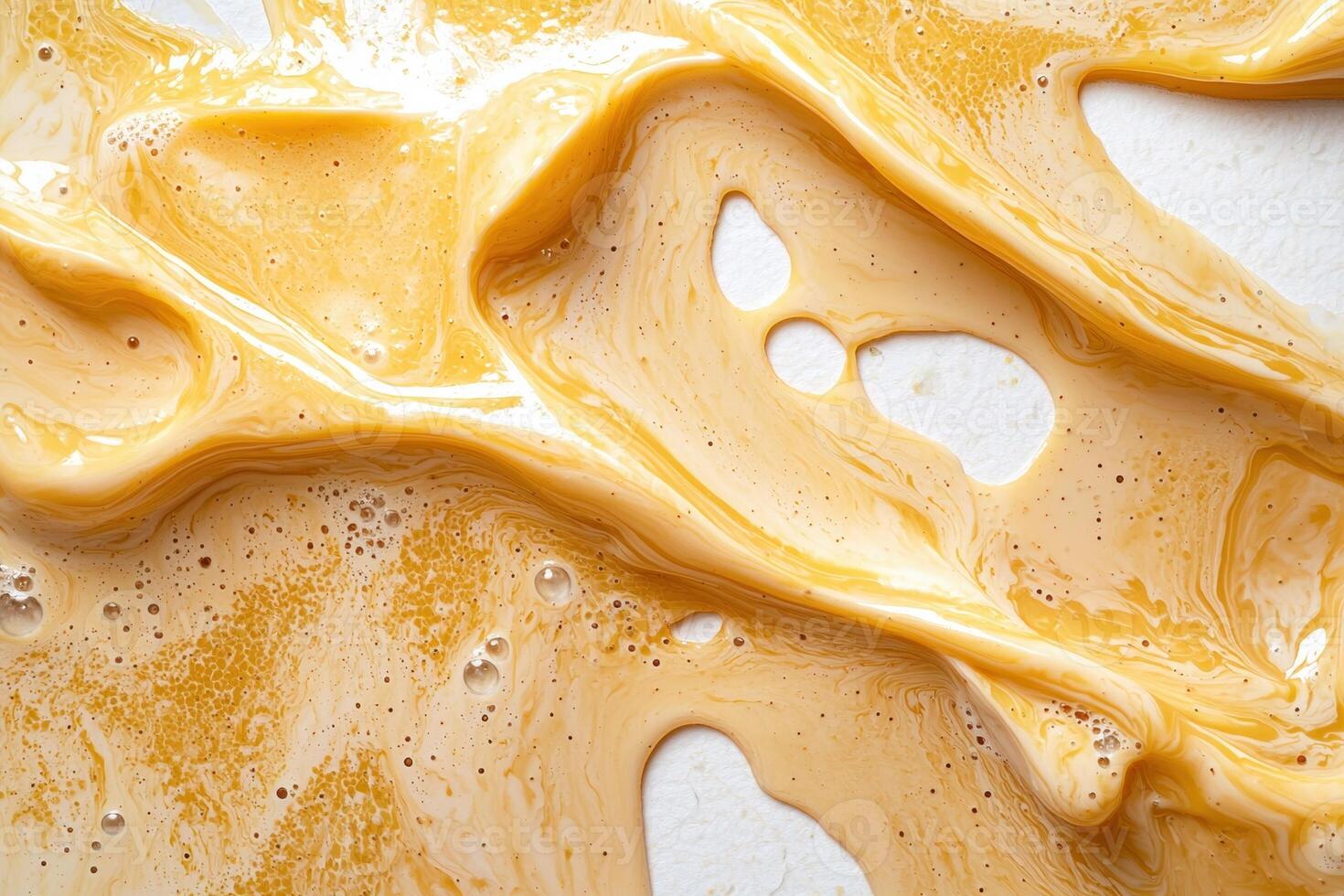 Abstract background of yellow liquid with bubbles and swirls photo