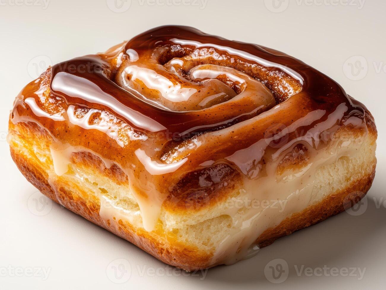 Close up of a delicious cinnamon roll with a glossy glaze. photo