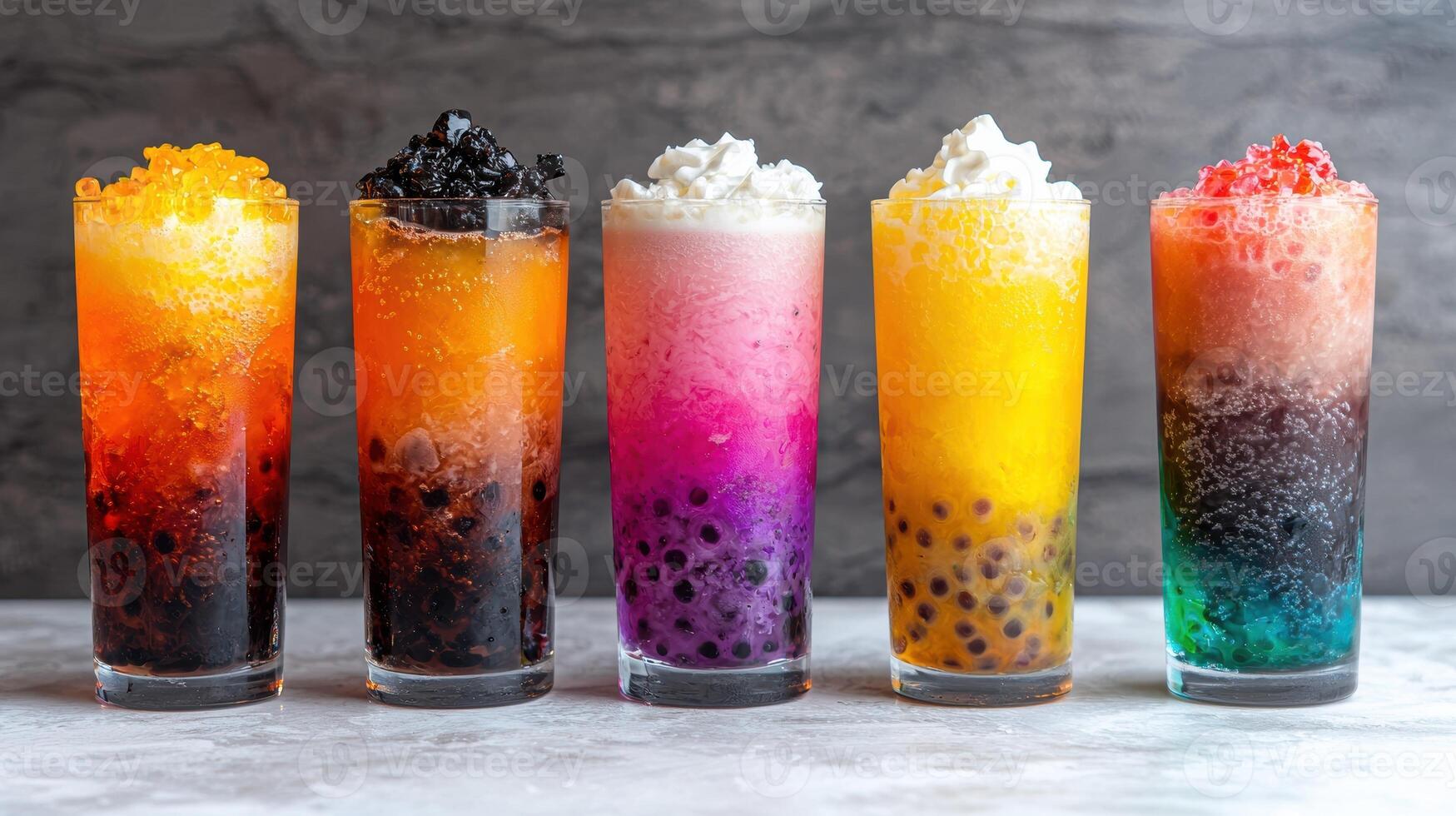 Five colorful bubble tea drinks with different toppings photo