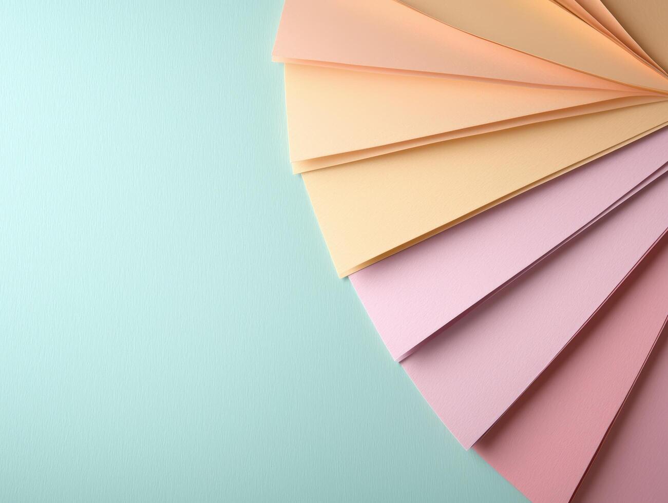 Pastel color palette arranged in a fan shape on a light blue background photo