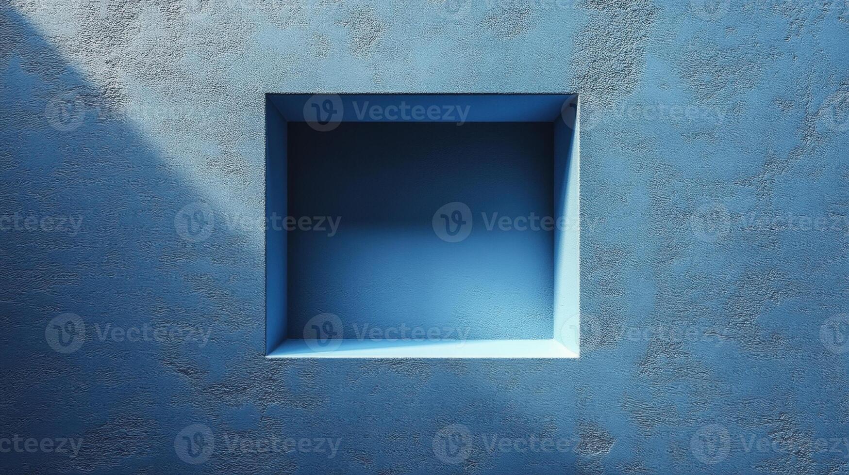 Minimalist architectural detail of a sunlit square niche in textured blue wall. photo