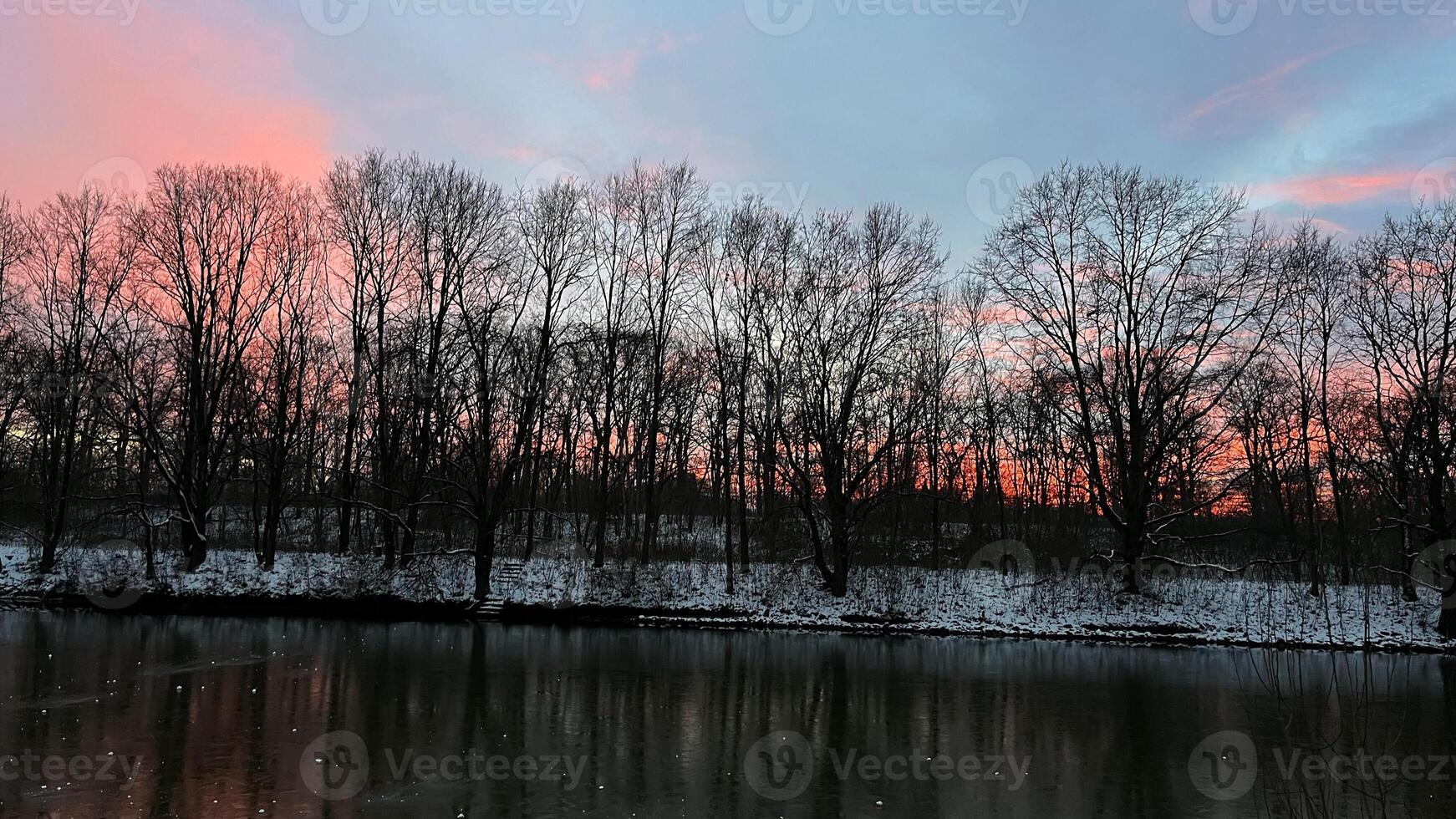 Colorful winter sunset over the Oder River, Poland photo