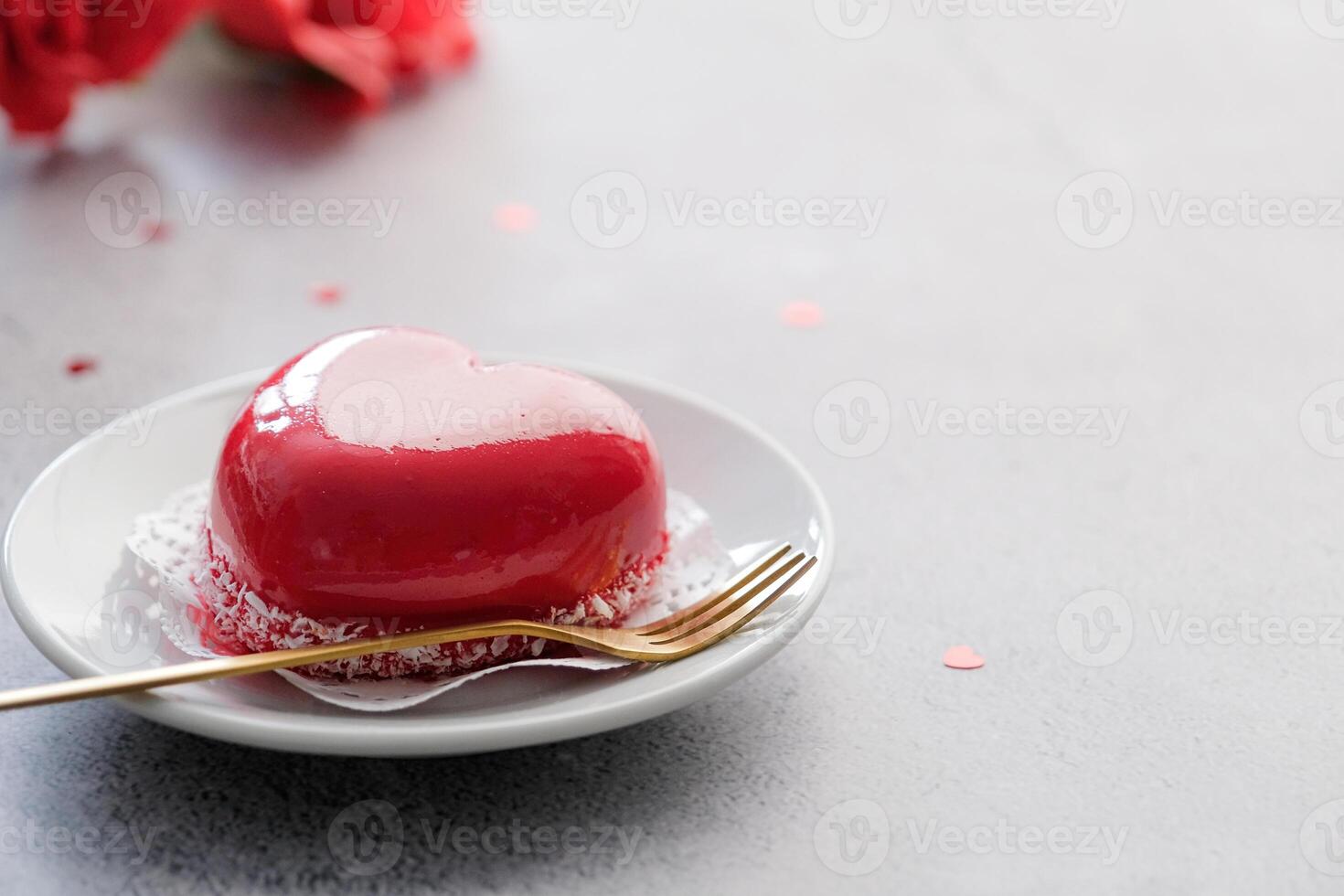red heart cake on small plate for valentines day photo