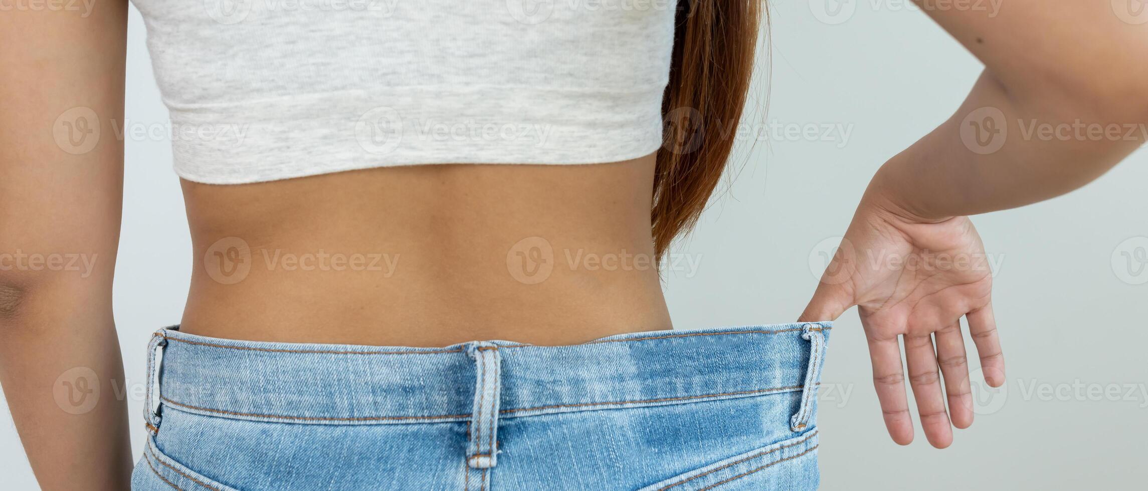 Beautiful shape. female have a reduced waist size after under going a weight loss corse. can not wear jeans due to weight loss. balance, control, routines, exercise. photo