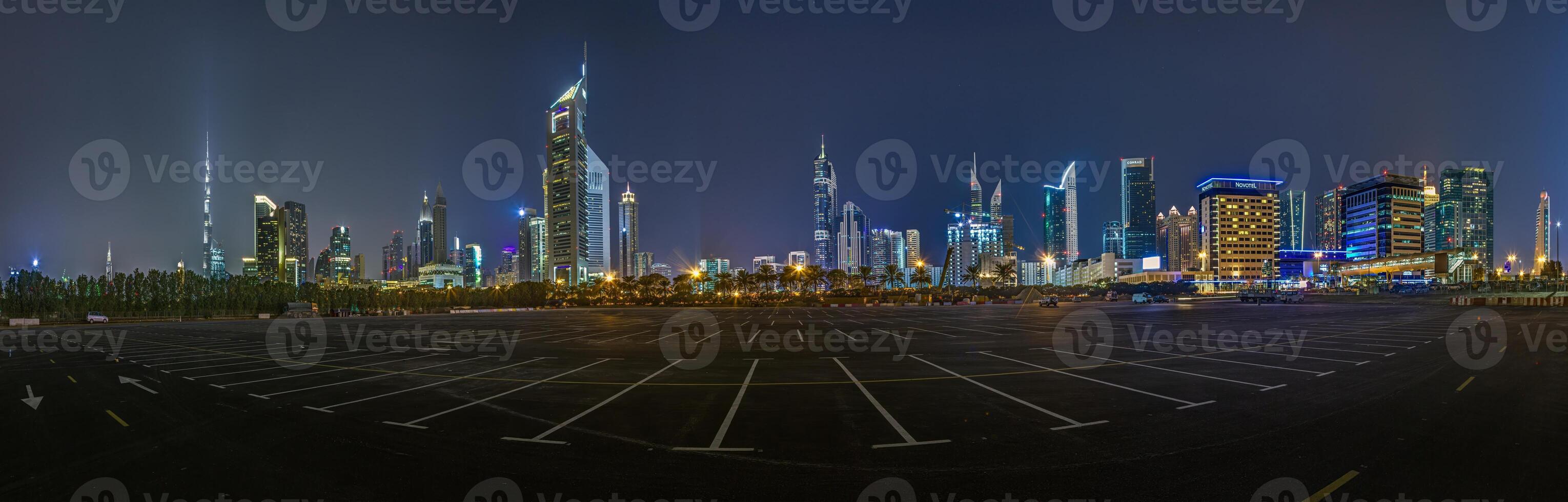 Dubai skyline panorama at night with illuminated skyscrapers in 2015- photo
