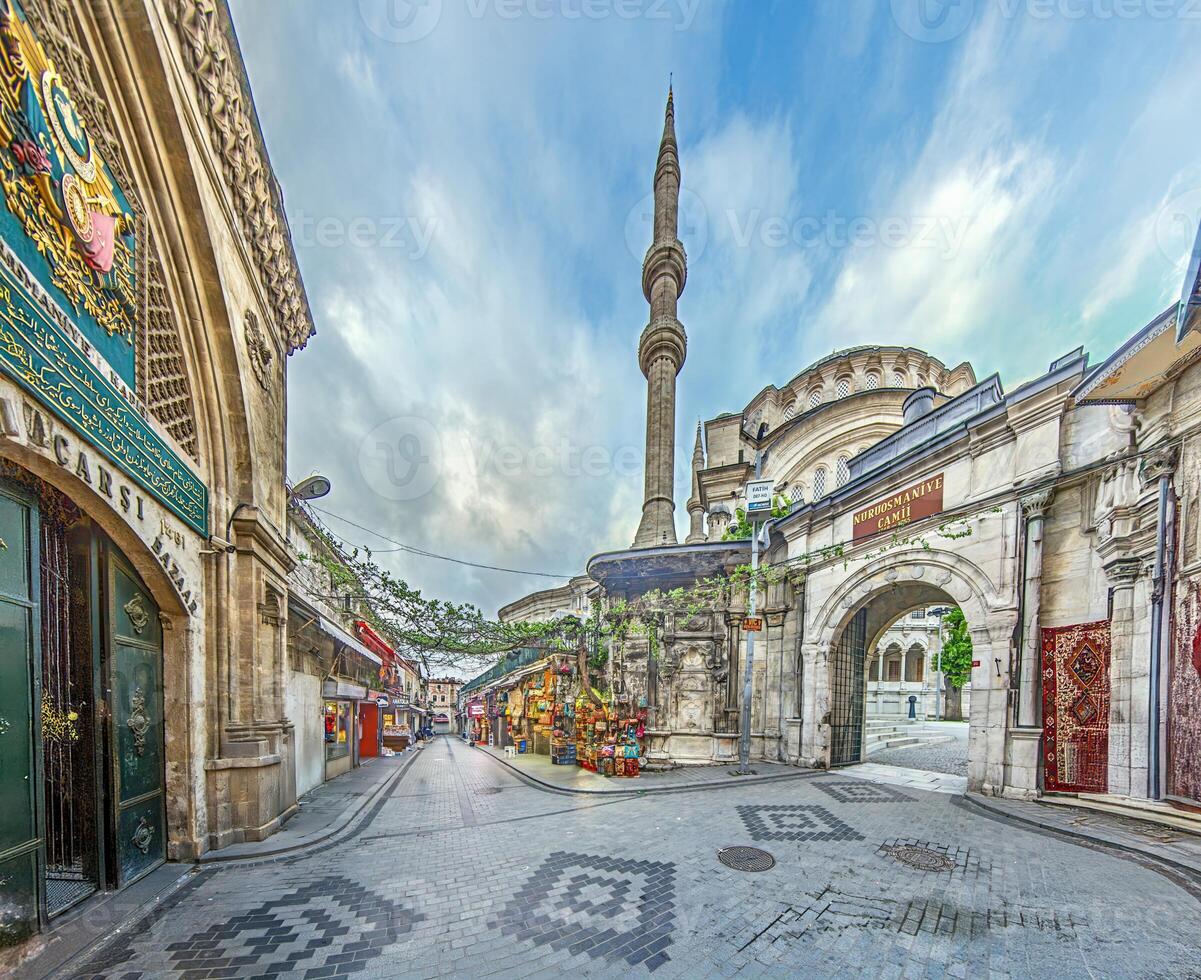 Wide angle view of a bazaar in Istanbul with shops and historic architecture photo