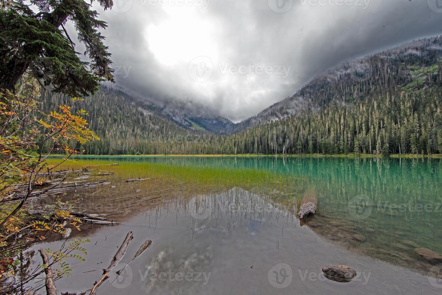 Hiking view near Mt Garibaldi with turquoise lake and dramatic clouds in the mountains-- photo