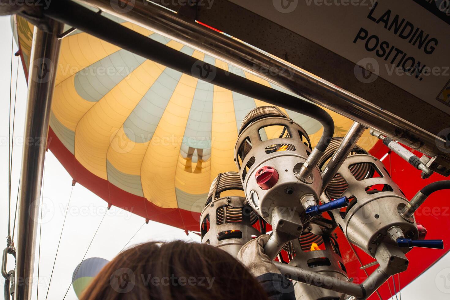 Goreme, Turkey , 2024 - inside view flames and inflating Hot air balloon in Cappadocia. The place where the balloons take off.Preparation of the balloon with basket for take-off photo