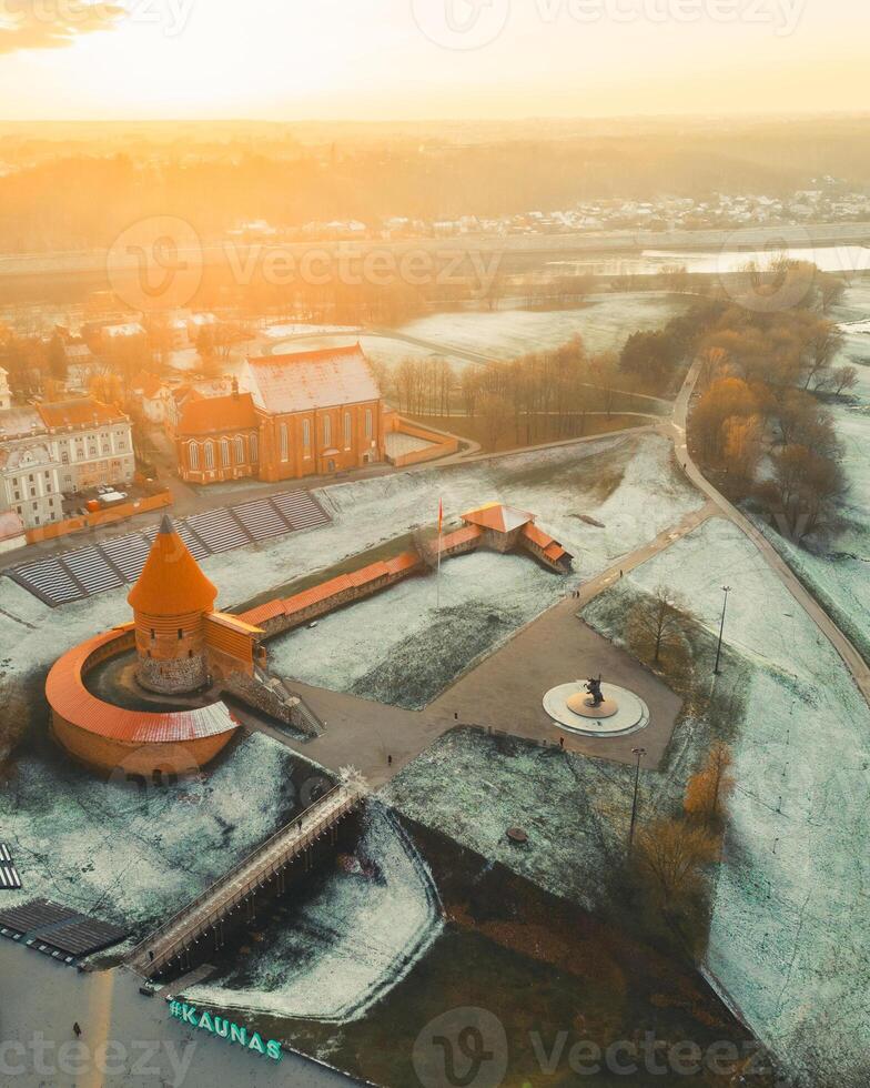 Kaunas, Lithuania - 19th november, 2024- aerial top down view renovated Kaunas Medieval castle. Popular landmark - tourist attraction. Historical archeological site. Nemunas river on sunset photo