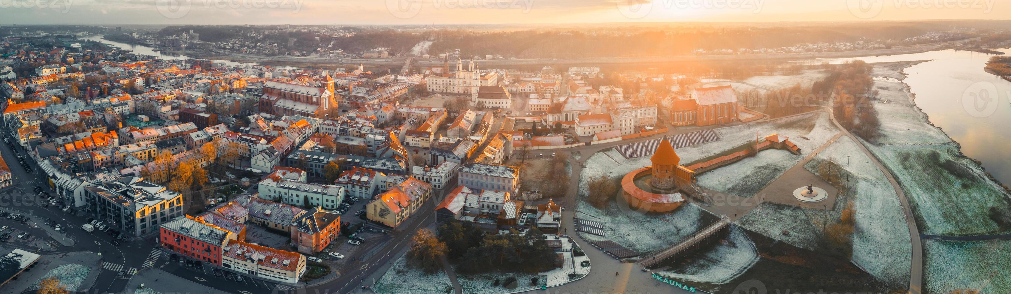 Kaunas, Lithuania - 28th november, 2024- aerial beautiful panorama view Kaunas Old Town buildings at sunset. Heart of Lithuania. Kaunas Town Hall Square. Kaunas castle. Church of St. Francis Xavier photo