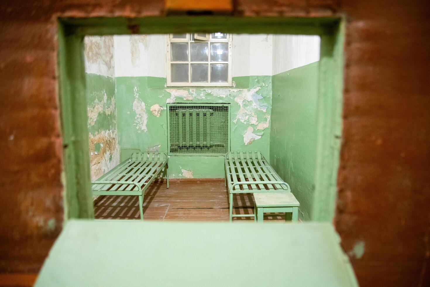 Vilnius, Lithuania - 30th november, 2024- kgb underground prison cells with bunk beds. The Museum of Occupations and Freedom Fights in Vilnius. Soviet occupation of Lithuania photo