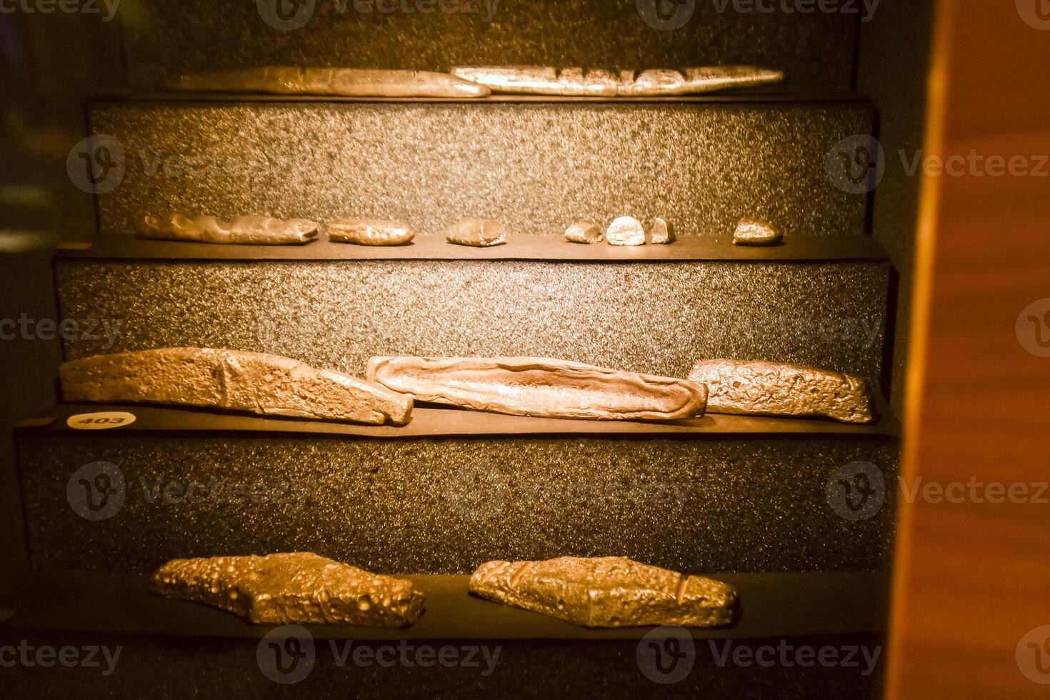 Vilnius, Lithuania - 29th november, 2024- fragments of lithuanian longs on display in Lithuania money museum.It was commodity money in the form of silver ingots. Semicircular rods. photo