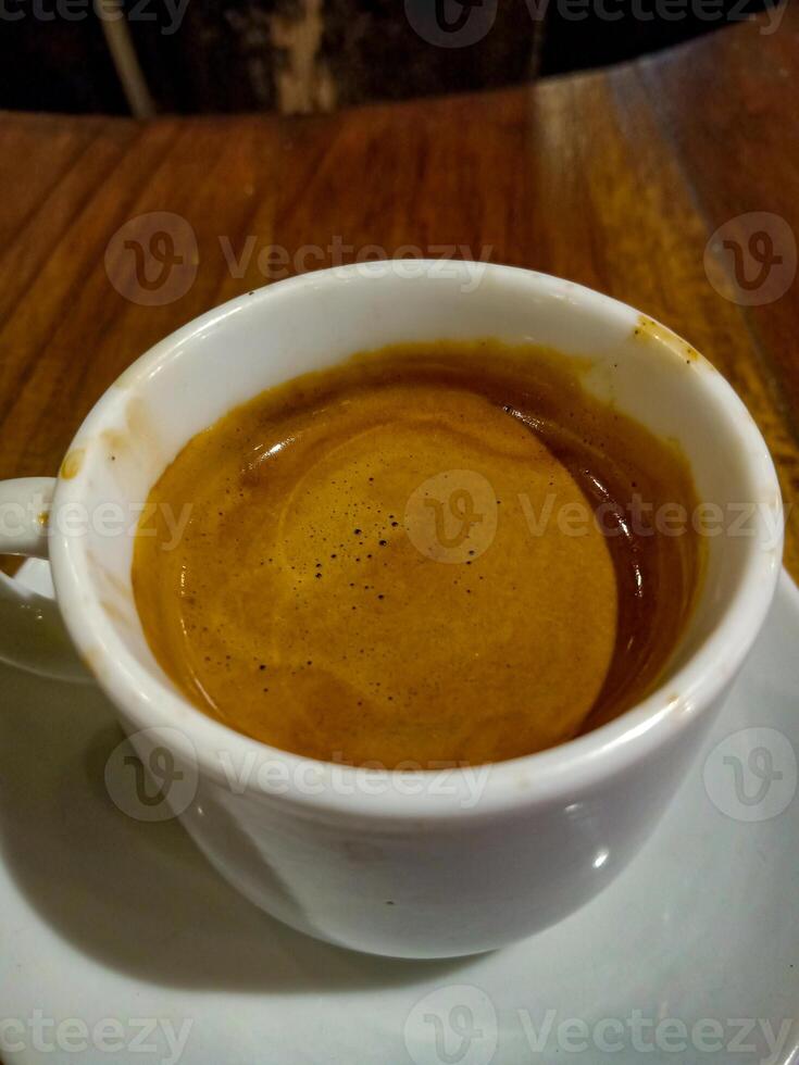 A full espresso shot is taken from the top. photo