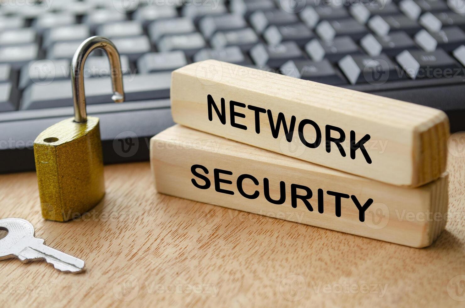 Network Security text on wooden blocks with locker pad and keyboard background photo