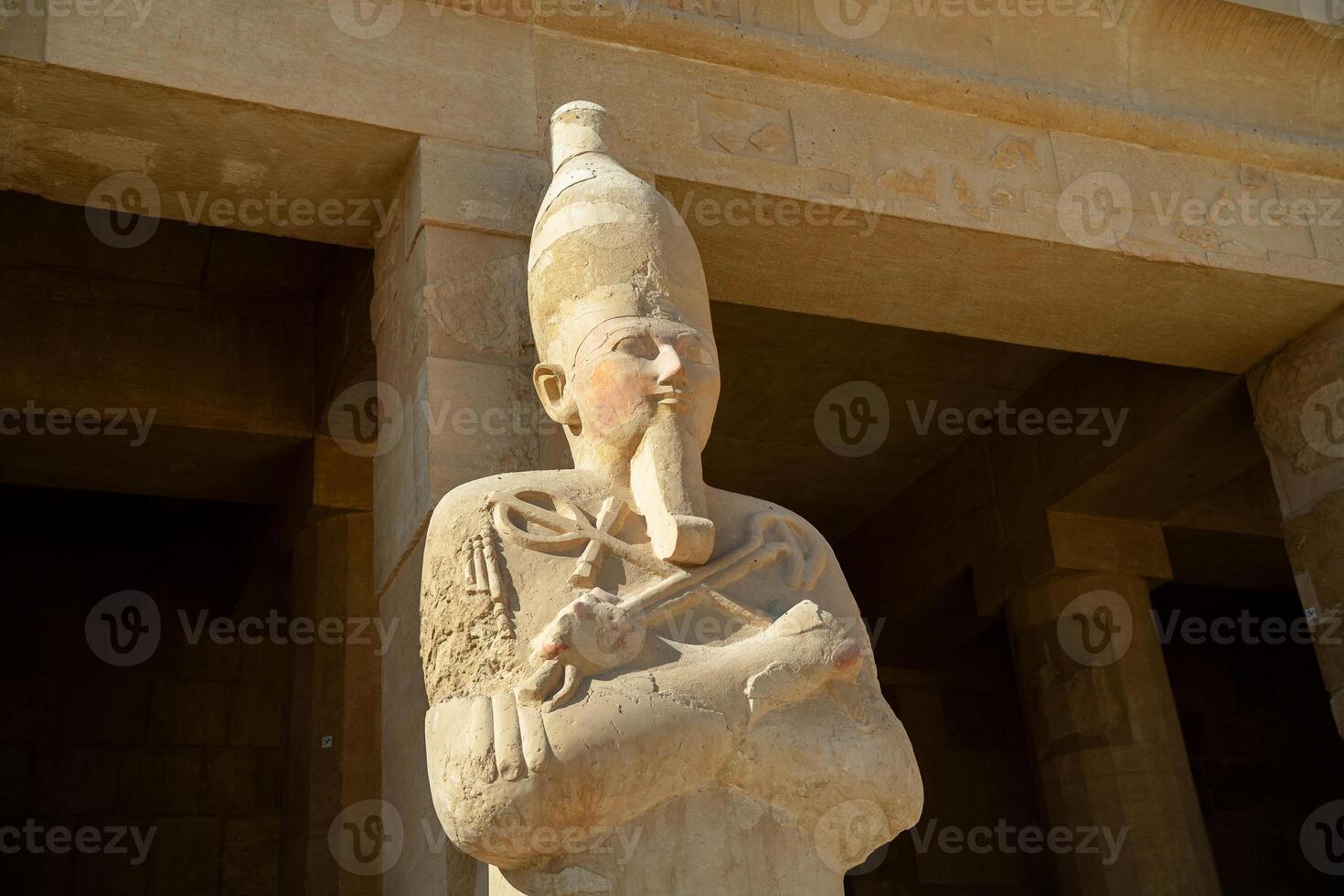 Statue of pharaohs near the walls of the temple of Hatshepsut photo