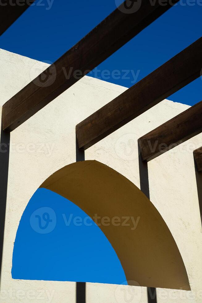 Arabic window with crossbars against the sky photo