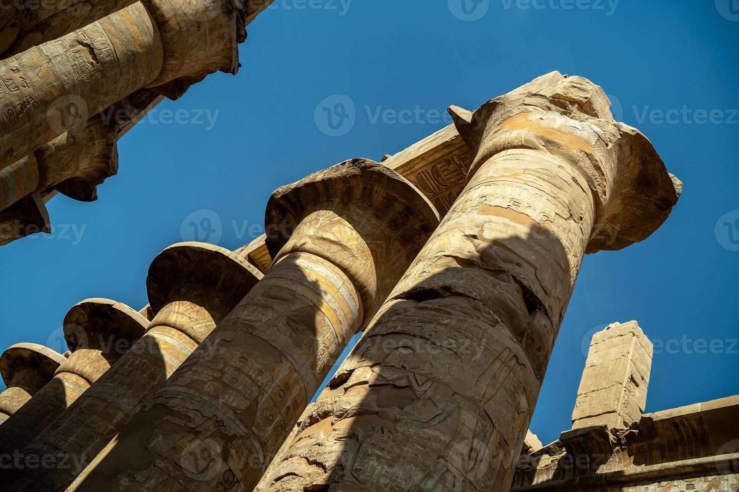 Egyptian columns statues with drawings in Karnak photo