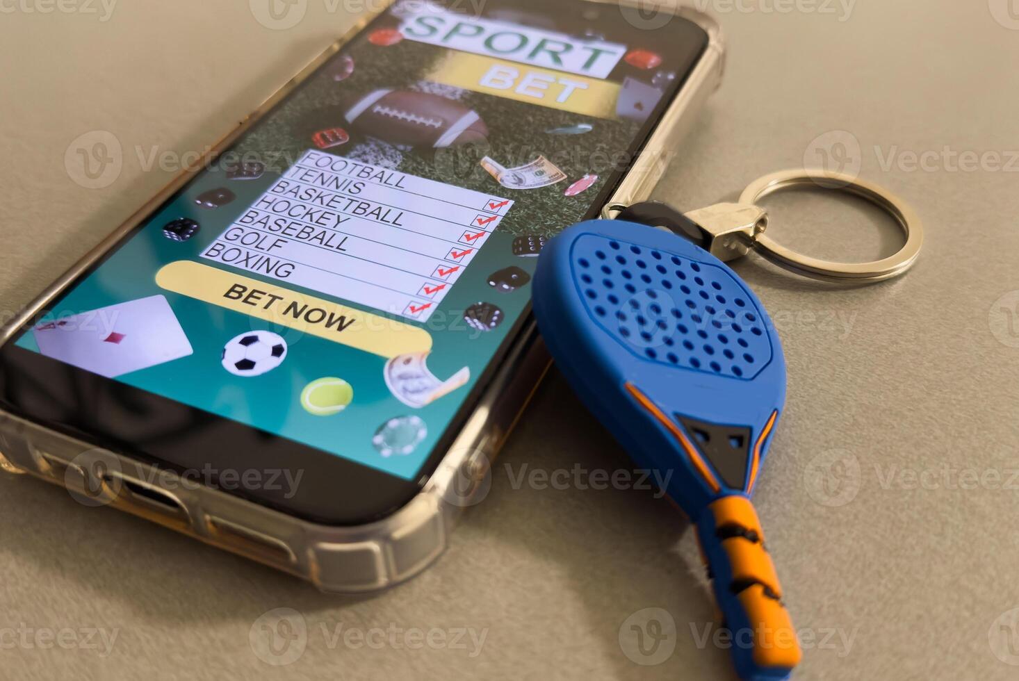 padel racket and smartphone with sports betting photo