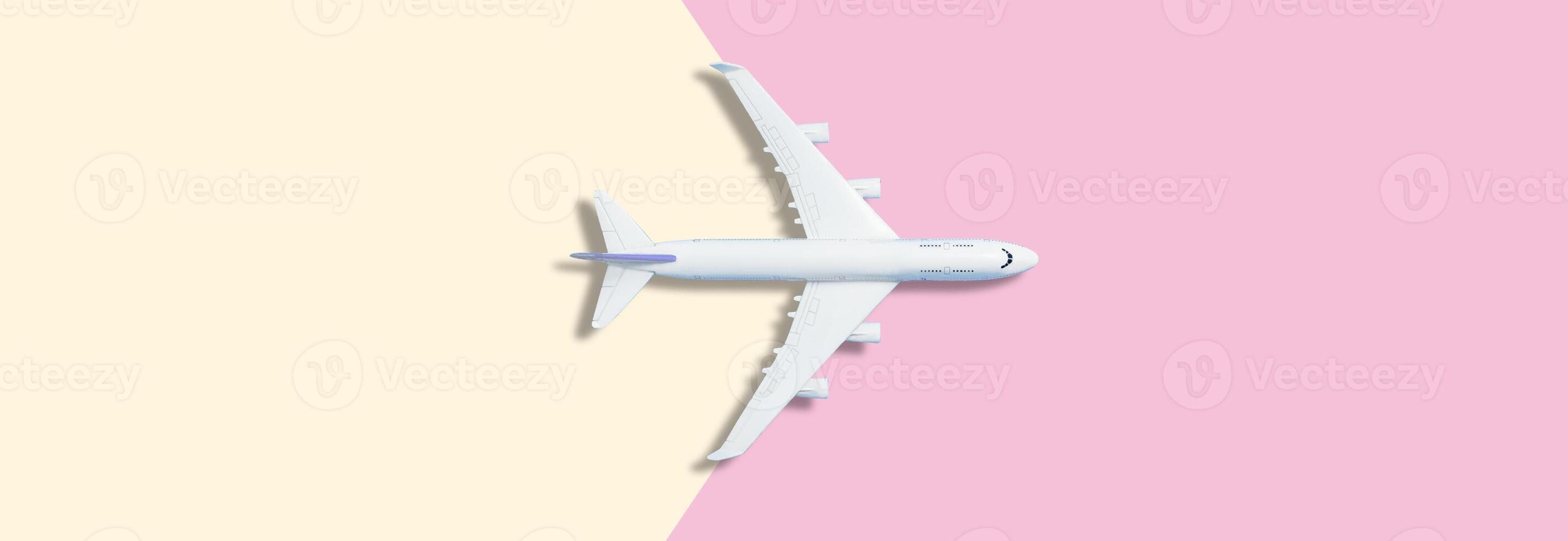 Airplane model. White plane on background. Travel vacation concept. Summer background. Flat lay, top view, copy space. photo