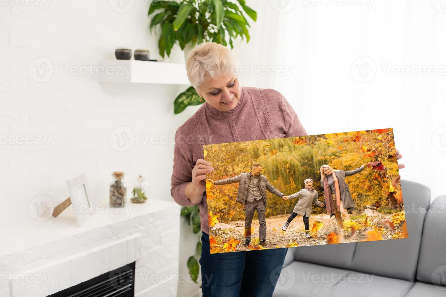 Canvas print with gallery wrap. woman hangs autumn photography, photocanvas photo