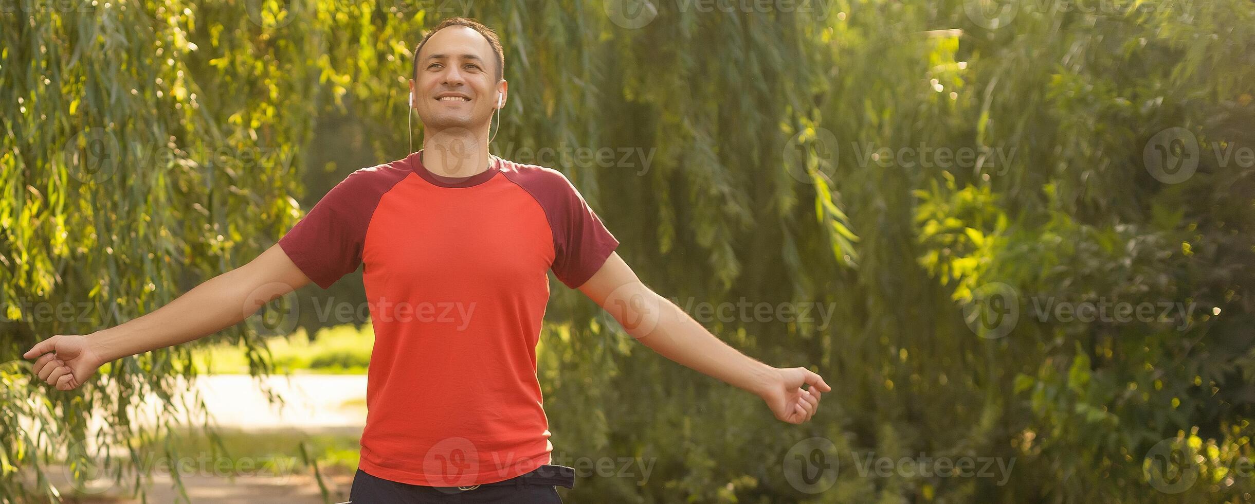 happy man in a park. Healthy lifestyle concept photo