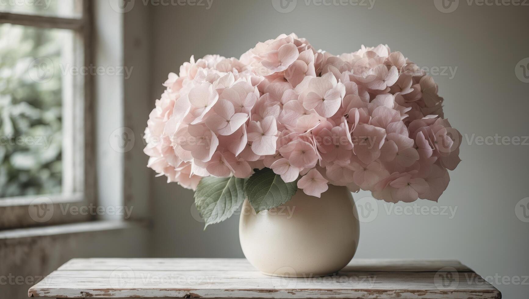 Beautiful pink hydrangeas in a white vase on a rustic wooden table by a windowBeautiful pink hydrangeas in a white vase on a rustic wooden table by a window. photo