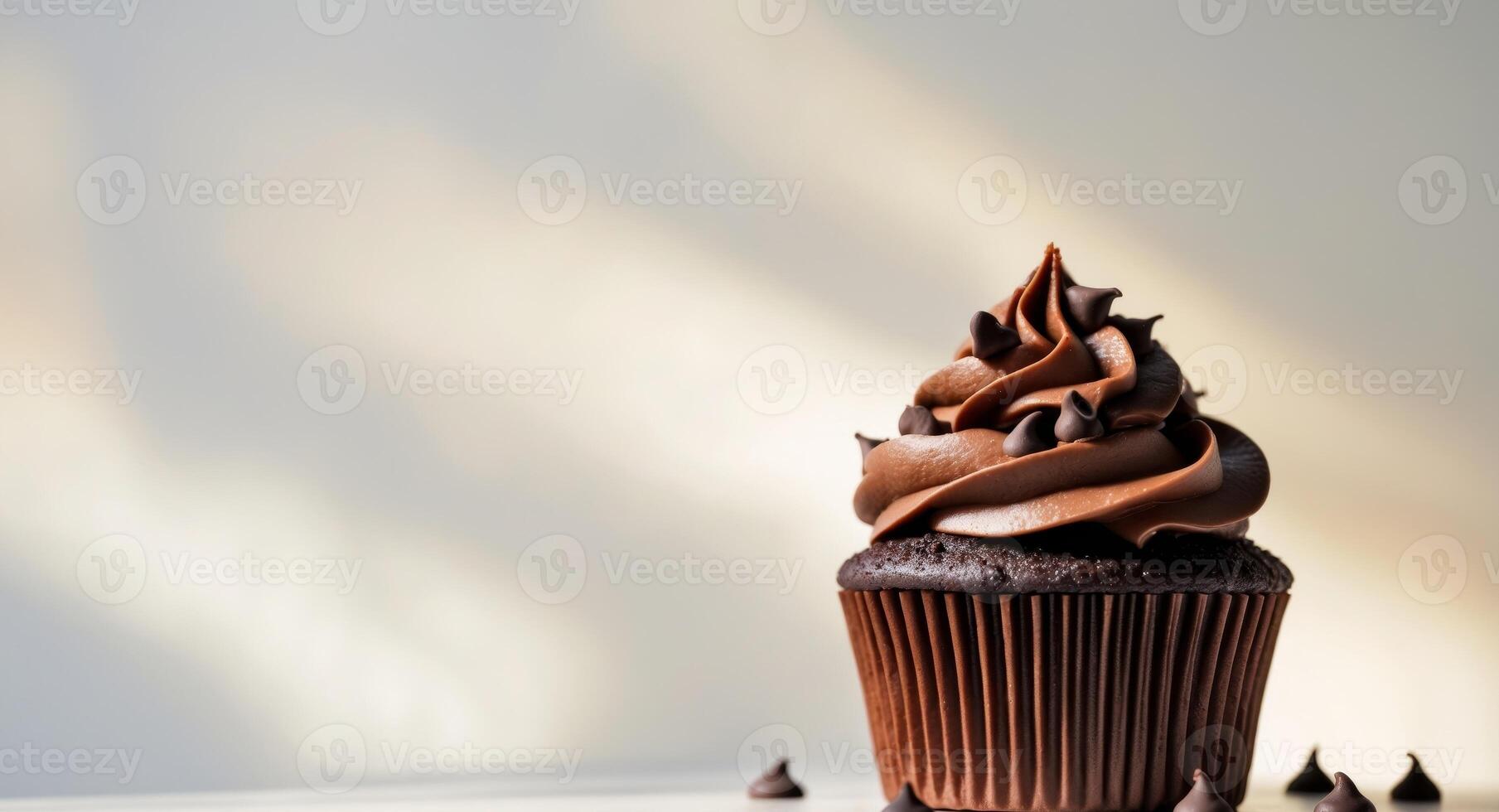 of chocolate cupcake with chocolate frosting and chocolate sprinkle photo
