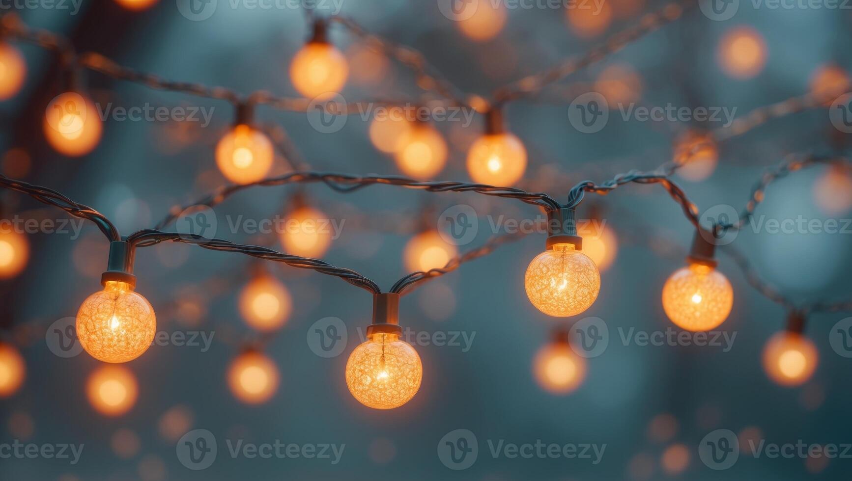 Glowing decorative string lights with warm orange bulbs create cozy ambiance photo