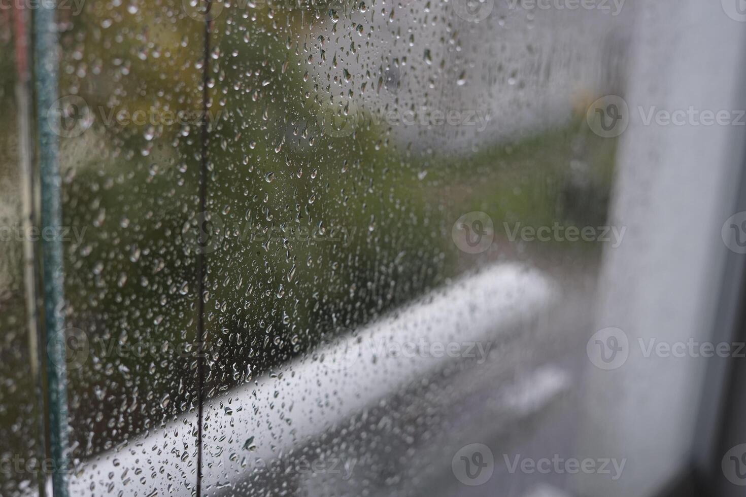 Rain drops close up on window glass outdoors. Summer rain. Texture of water in heavy rain. Macro. photo