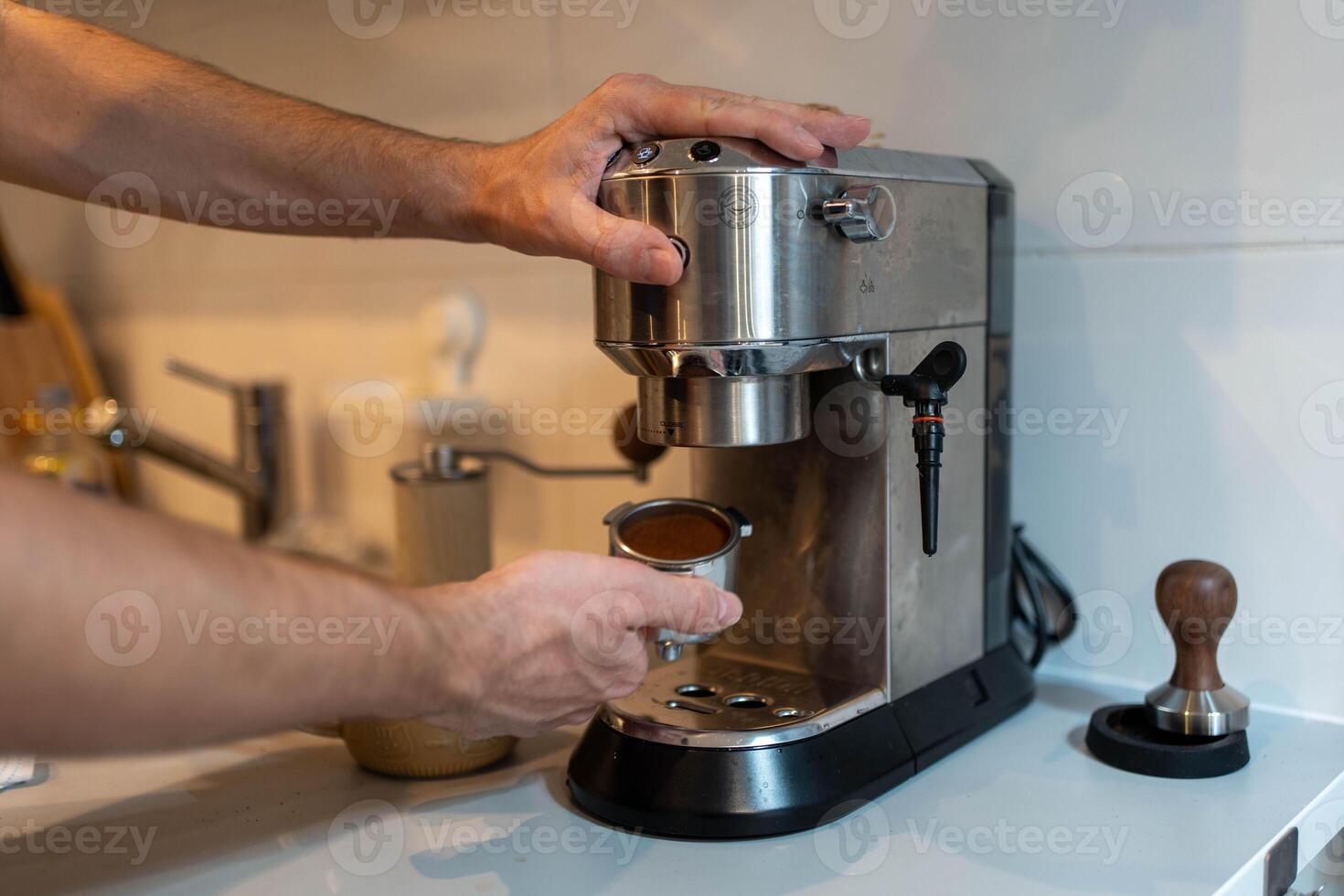 Man brews coffee at home photo