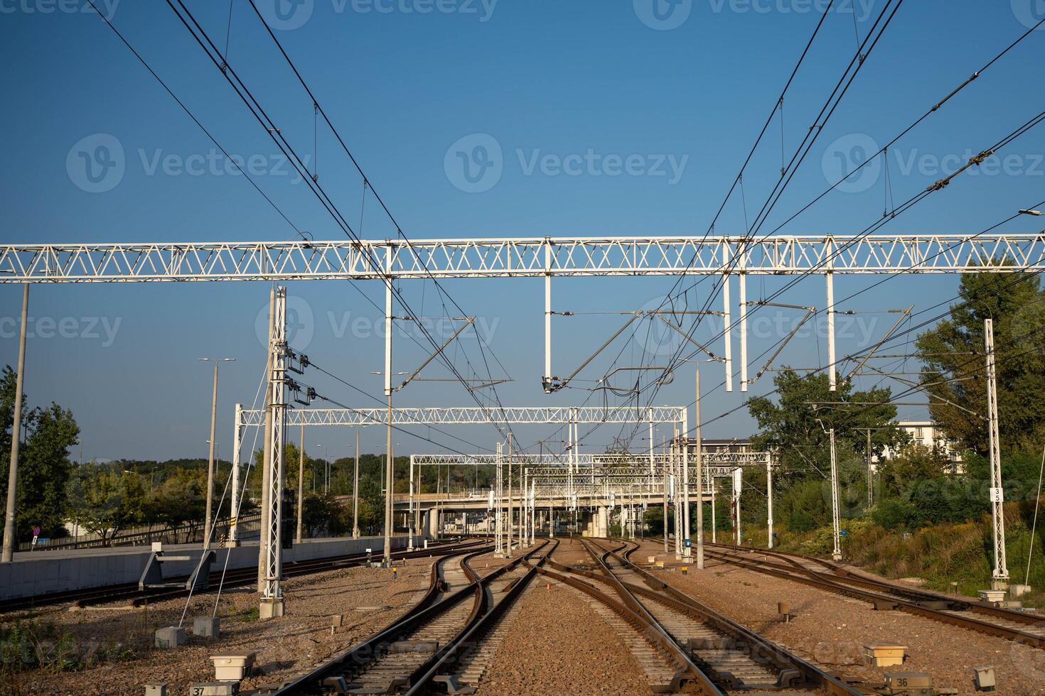 Railway Tracks with Overhead Power Lines photo
