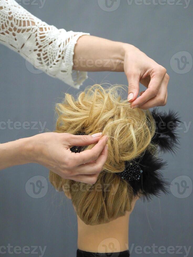 Training hair styling on a mannequin. photo
