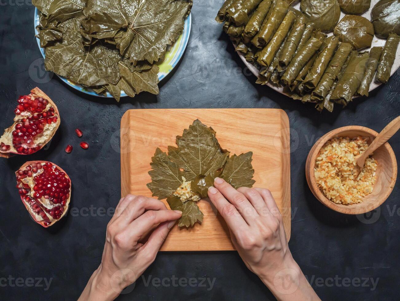 Preparation of Dolma from grape leaves photo