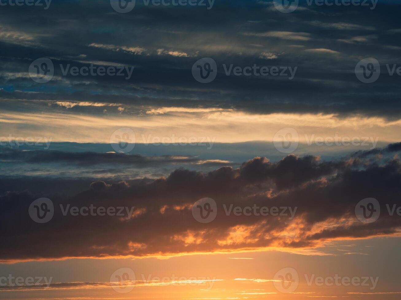 Dramatic sunset with a twilight blue color of the sky and clouds photo