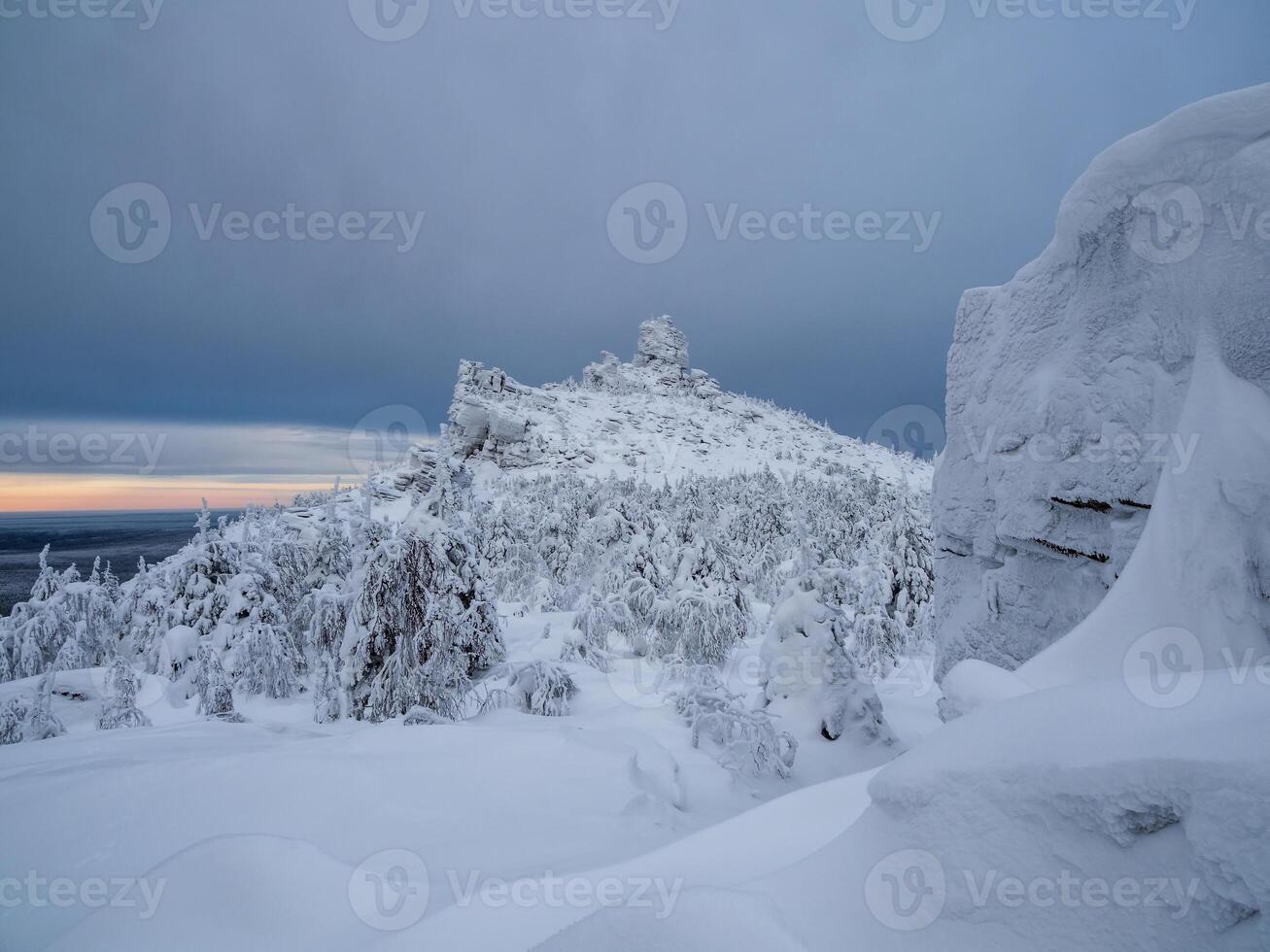 Stone pillars of weathering in winter. Russia photo