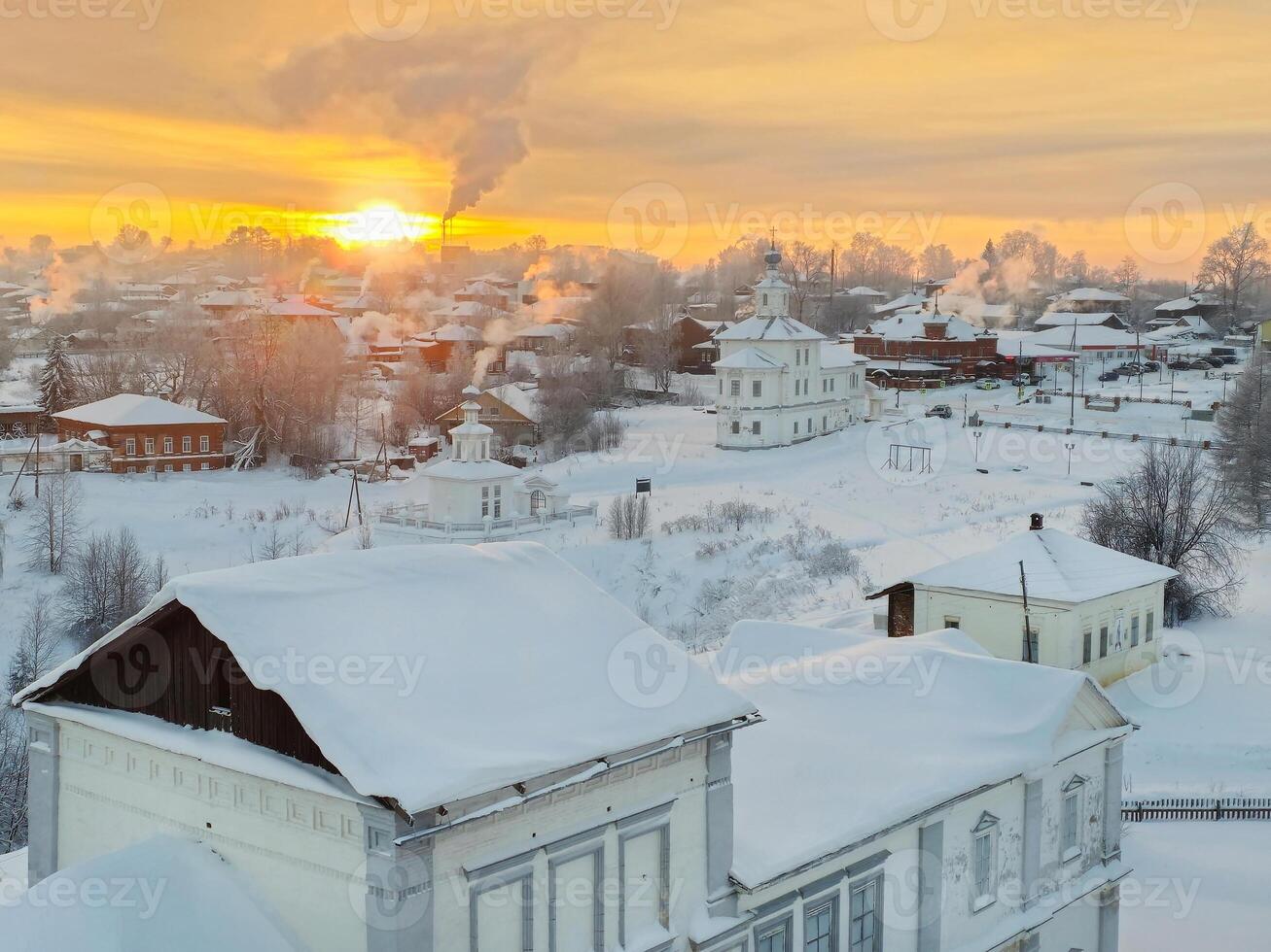 Winter in the Russian countryside. Ancient wooden hut . photo
