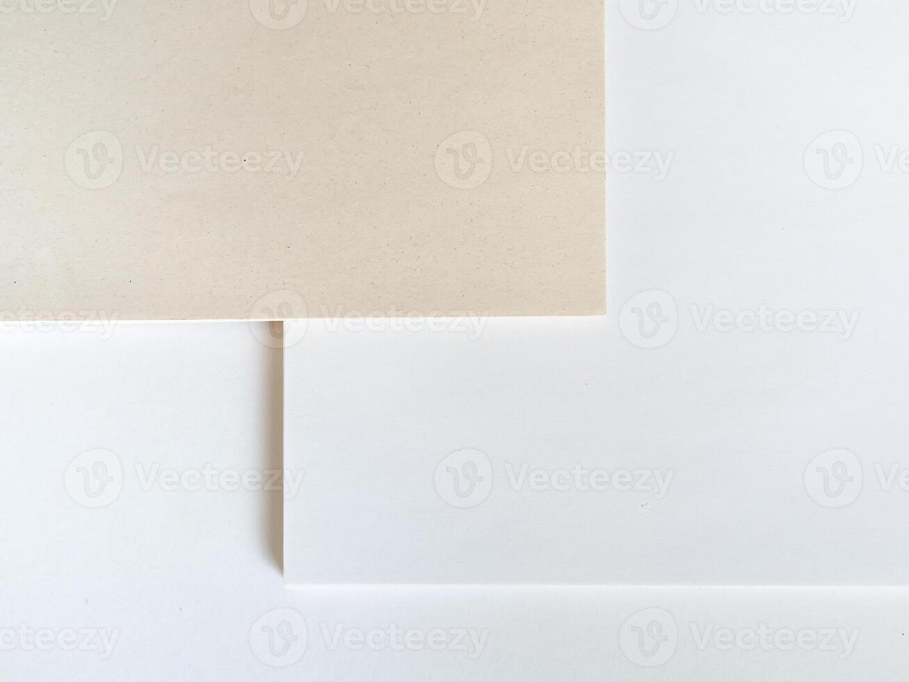 Paper without bleaching in comparison with ordinary white of high quality. White recycled paper background or texture. Import substitution. Flat lay, copy space photo