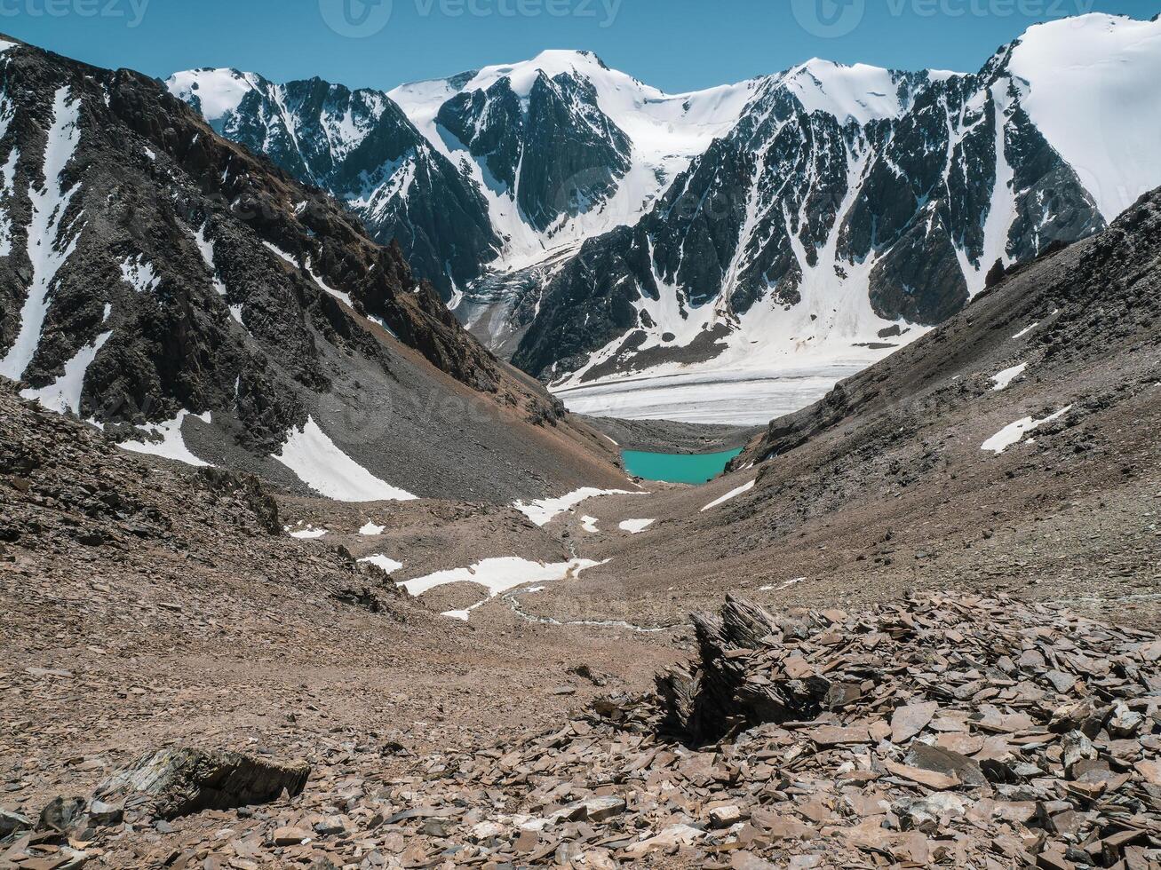Beautiful view to mountain lake on background of mountains. Atmospheric landscape photo