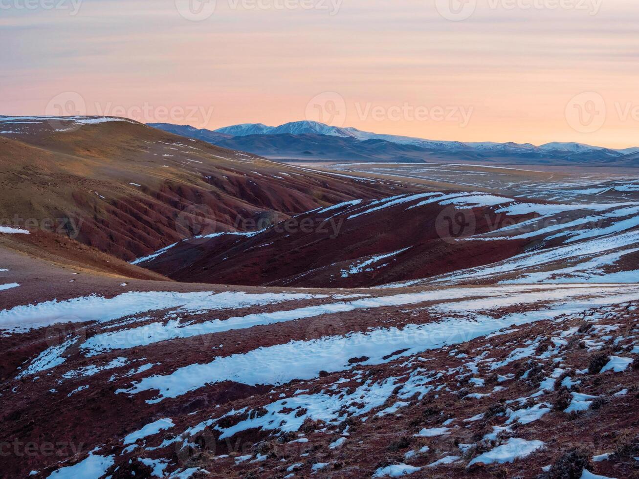 Scenic view from snow-covered stony pass to beautiful mottled rocks photo