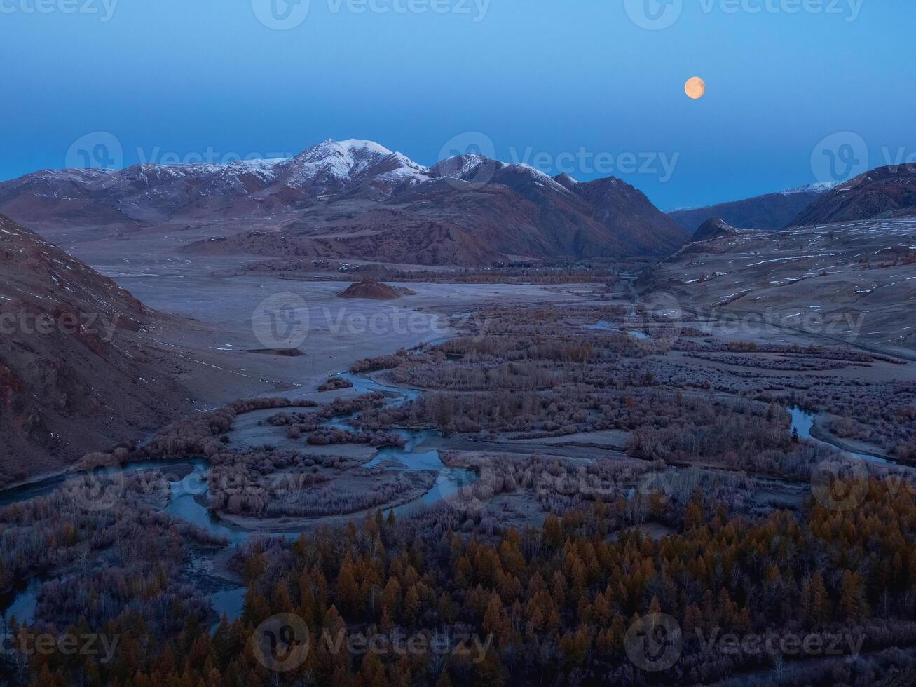 Amazing mystical moonlit night in a mountain valley photo
