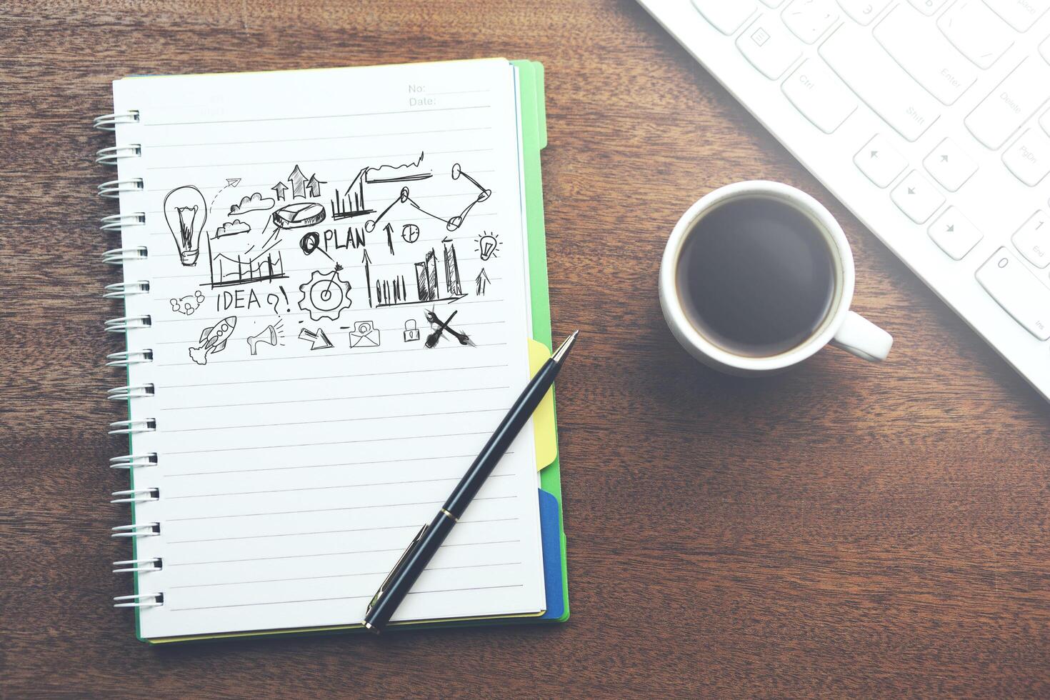 Sketching good ideas with coffee and keyboard photo