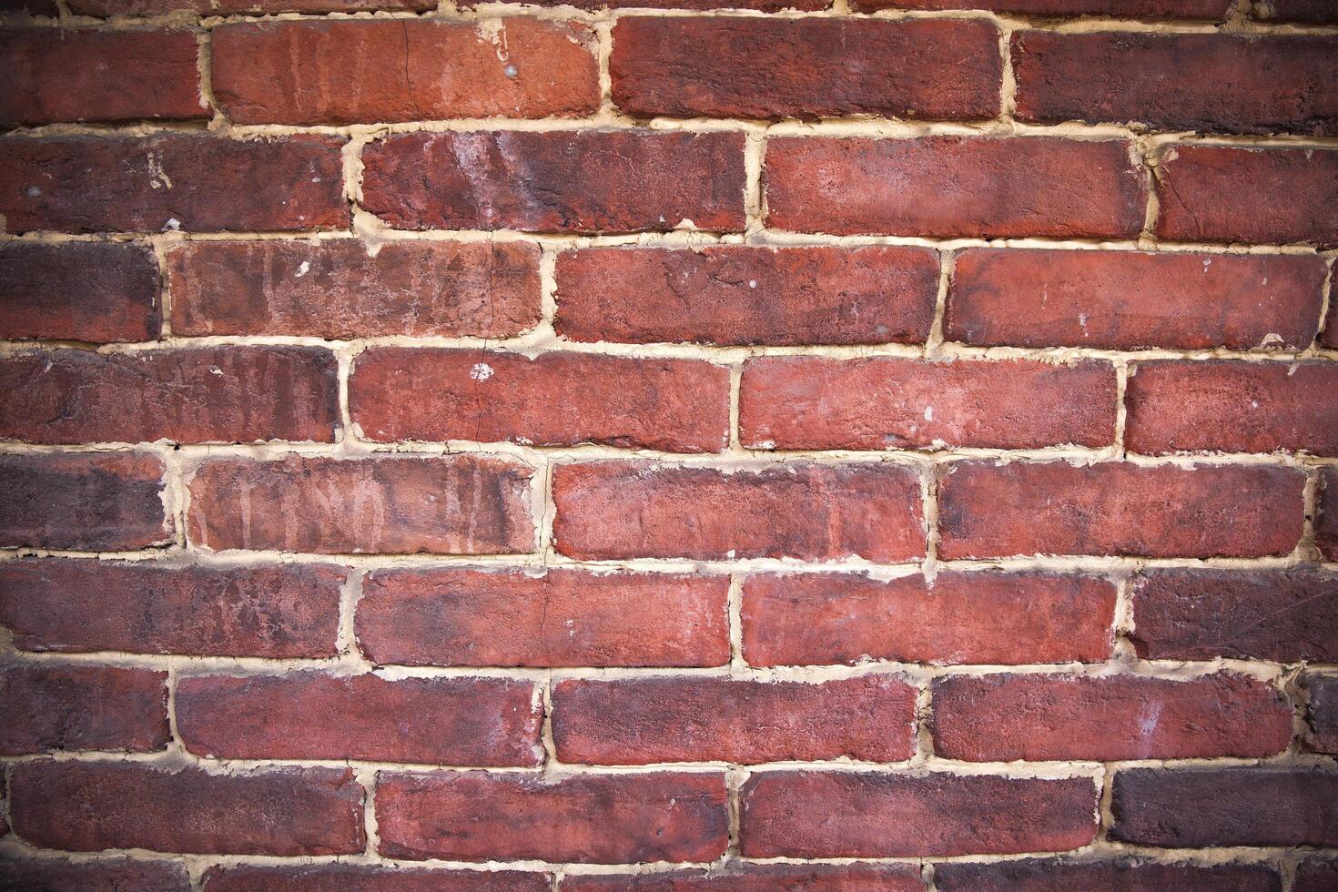 A close up of an old red brick wall photo