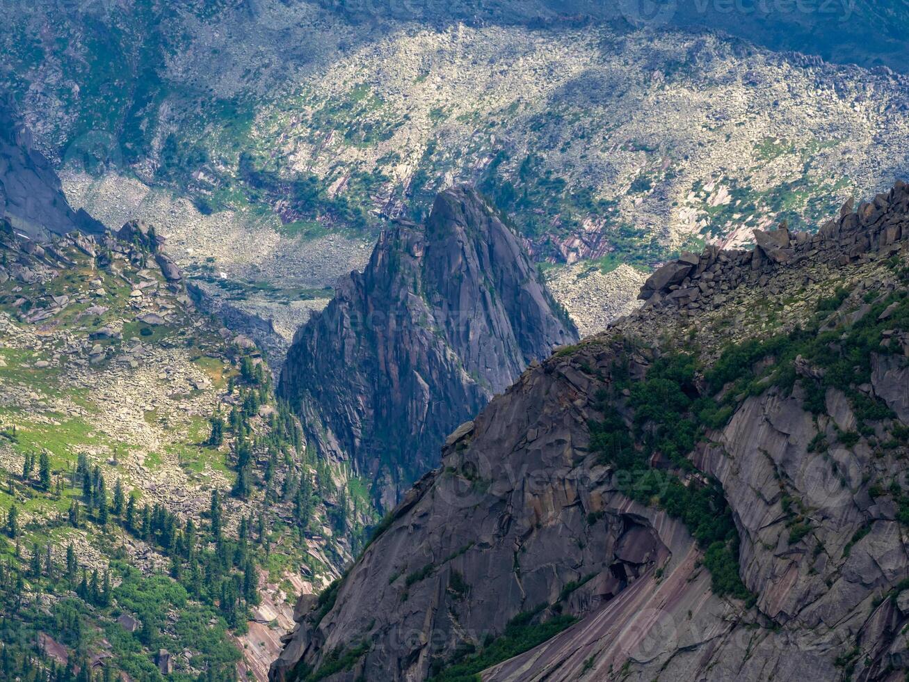 Aerial landscape photography of beautiful mountains and valleys of West Sayans. Scenic view of foggy mountains. Clouds and green mountain forest view. photo