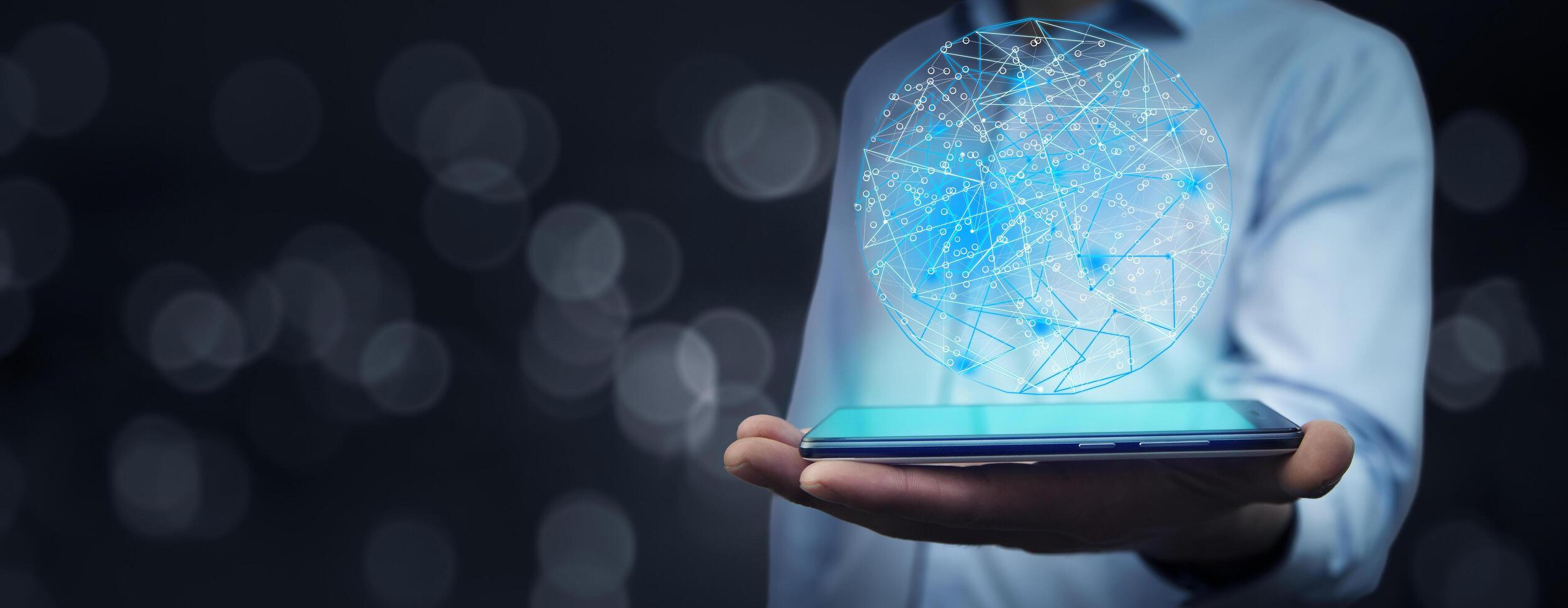 A man holding a smartphone with a digital network on it photo