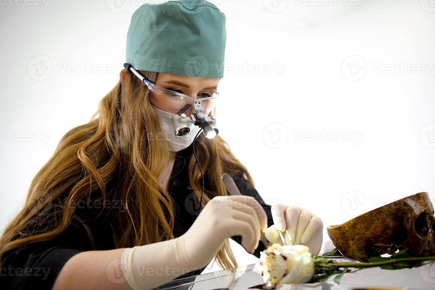 Scientist examining different botanical samples with microscope and test tubes. Noting observations while arranging plants and flowers in various laboratory apparatus photo