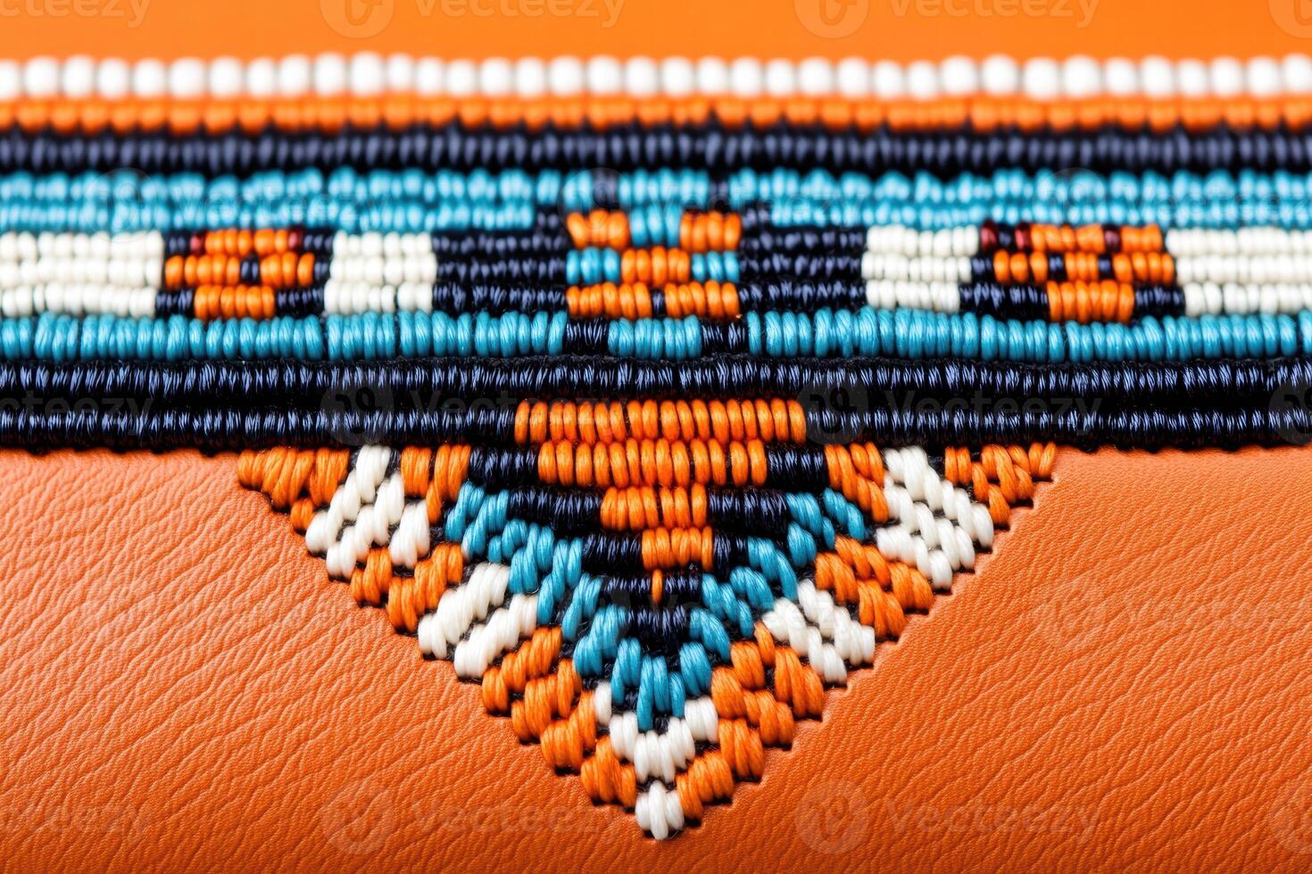 Close-up view of vibrant Native American beadwork on leather pouch highlighting intricate patterns and craftsmanship photo
