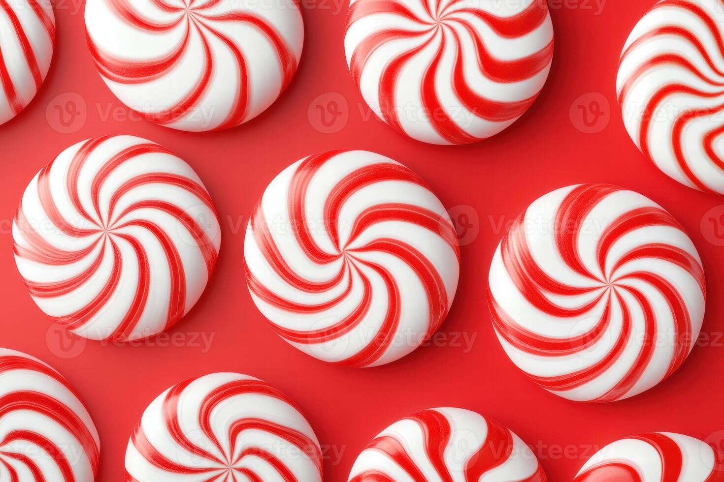 Swirling red and white candy arranged playfully on a glossy red surface, creating a festive and cheerful visual delight photo